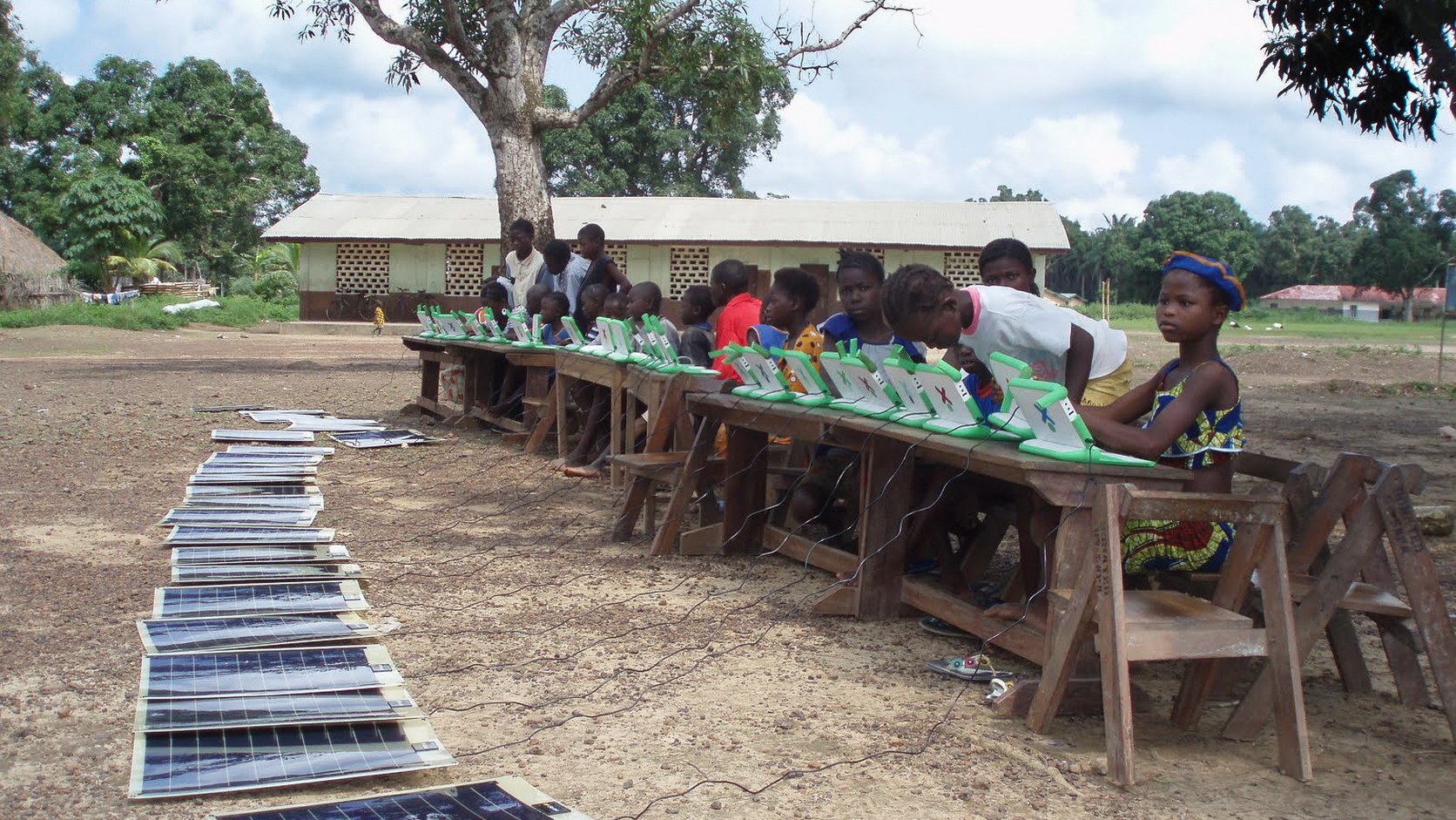Students using solar-powered laptops at a school in Sahn Malen, Sierra Leone